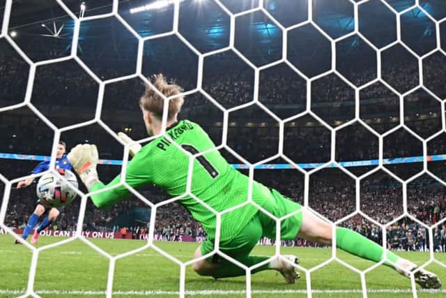 Jordan Pickford saves a penalty from Italy’s Andrea Belotti in the  EURO 2020 final.