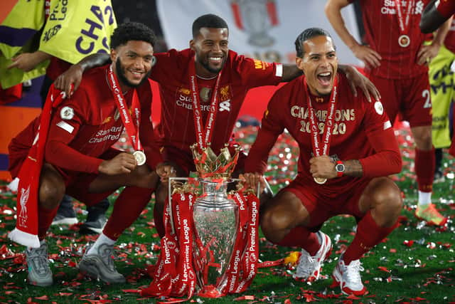 Virgil van Dijk, right, celebrates Liverpool’s Premier League title triumph in 2020 with Joe Gomez, left and Gini Wijnaldum. Picture: Phil Noble/ Getty Images