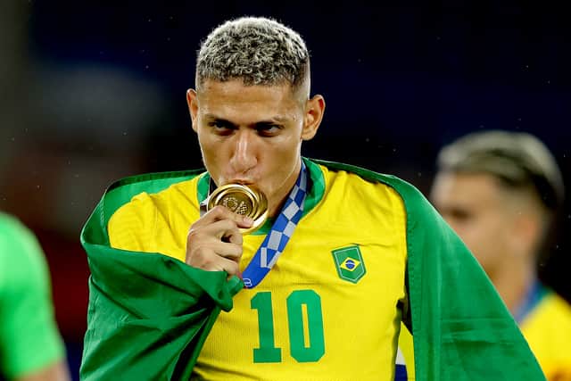 Richarlison celebrates with his gold medal after Brazil’s Olympics triumph. Picture: Francois Nel/Getty Images