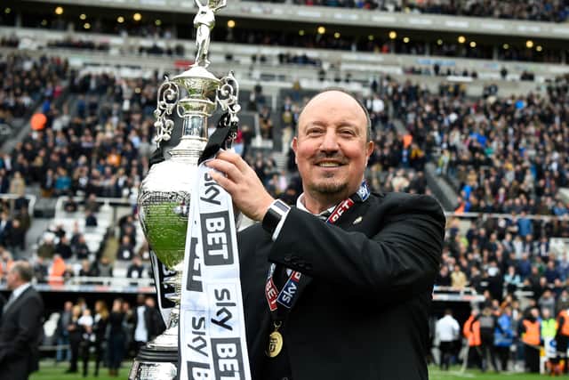 Rafa Benitez celebrates with the silverware after guidng Newcastle to the Championship title in 2017. Picture: Stu Forster/Getty Images