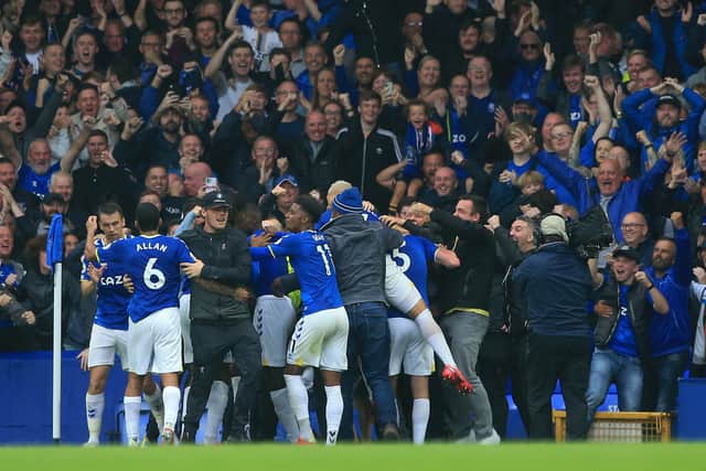 Everton fans invade the pitch after Abdoulaye Doucoure’s goal. Picture: LINDSEY PARNABY/AFP via Getty Images