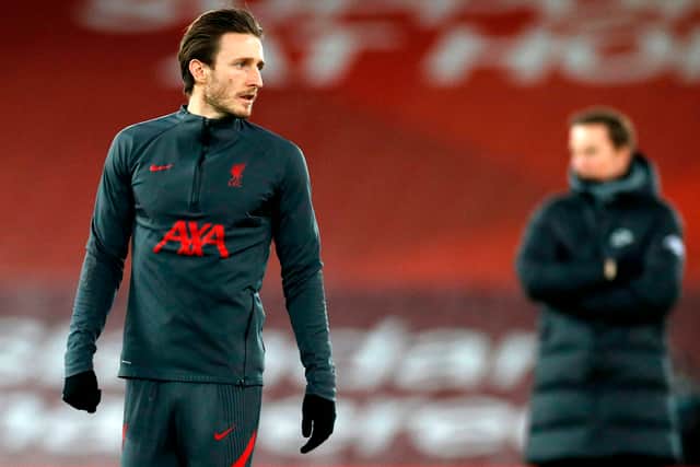 Ben Davies warms up for Liverpool ahead of a clash with Brighton last season. Picture: PHIL NOBLE/POOL/AFP via Getty Images