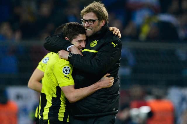 Robert Lewandowski is embraced by Jurgen Klopp after Borussia Dortmund’s defeat of Malaga in the Champions League in 2013. Picture: JOHN MACDOUGALL/AFP via Getty Images