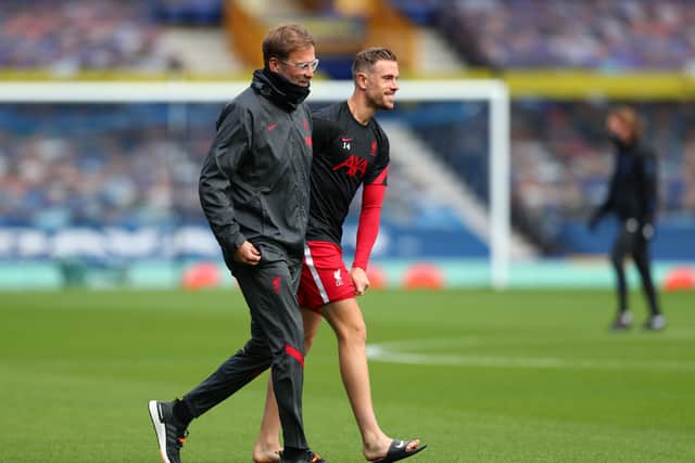 Liverpool boss Jurgen Klopp with captain Jordan Henderson. Picture: Catherine Ivill/Getty Images