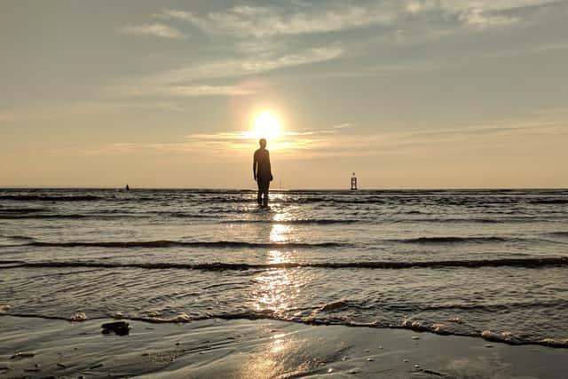 Some of the 100 cast iron statues facing towards the sea. Photo: Eddie Jordan / Shutterstock