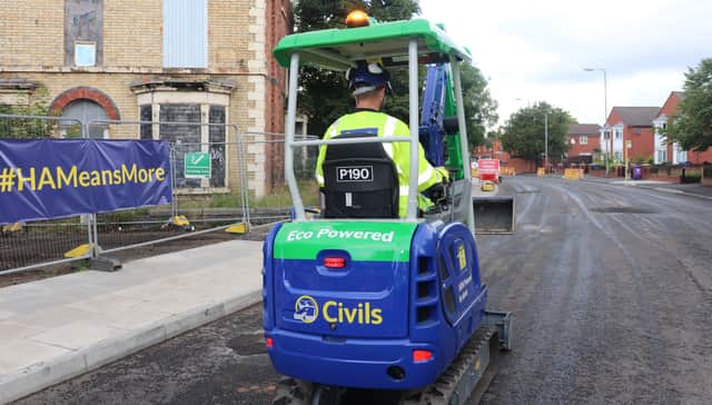 An eco digger hits the streets of Liverpool. Photo: Huyton Asphalt Ltd