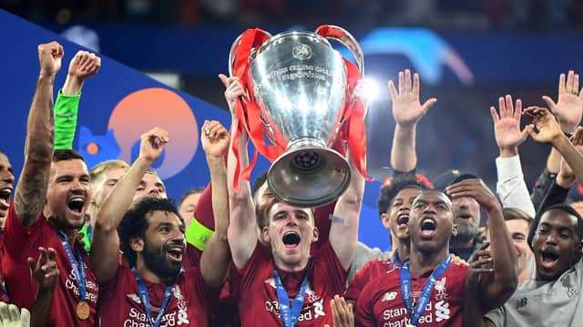 Andy Robertson lifts the Champions League trophy aloft following Liverpool’s triumph over Tottenham in 2019. Picture: Michael Regan/Getty Images