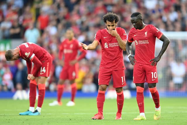 Mohamed Salah and Sadio Mane of Liverpool interact  during the Premier League match between Liverpool  and  Chelsea at Anfield on August 28, 2021 in Liverpool, England. (Photo by Michael Regan/Getty Images)
