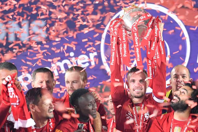 Liverpool captain Jordan Henderson lifts the Premier League trophy. Picture: Laurence Griffiths/Getty Images