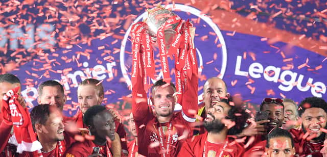 Liverpool captain Jordan Henderson lifts the Premier League trophy. Picture: Laurence Griffiths/Getty Images