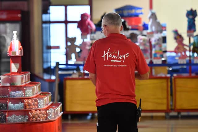 An assistant at Hamleys during lockdown. Photo: JUSTIN TALLIS/AFP via Getty Images