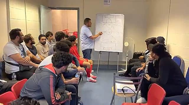Malik Al Shhadat gives a team talk to Phoenix FC