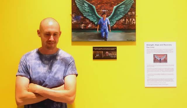 Paul Curtis with his Strength, Hope and Recovery piece at The Atkinson. Image: Paul Curtis Artwork