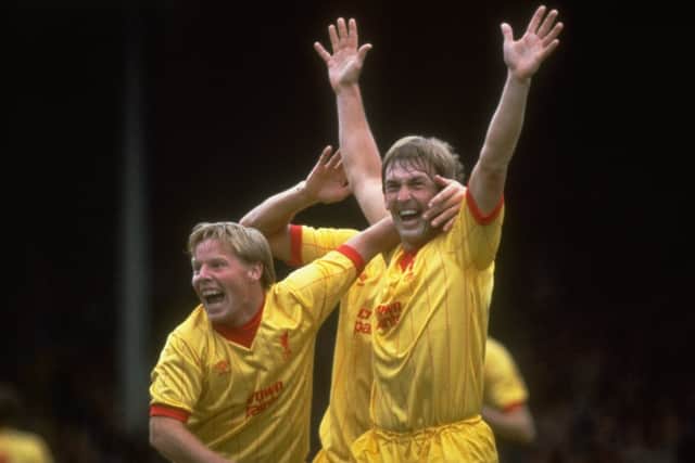 Liverpool’s Kenny Dalglish celebrates a goal with Sammy Lee in 1983. Image: Allsport/Getty Images