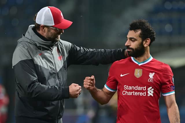 Liverpool boss Jurgen Klopp with Mo Salah. Picture: MIGUEL MEDINA/AFP via Getty Images