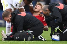 Harvey Elliott of Liverpool receives medical treatment during the Premier League match between Leeds United and Liverpool at Elland Road. Photo: Laurence Griffiths/Getty Images
