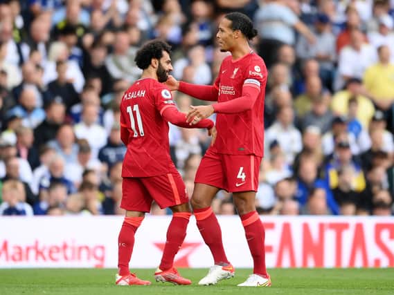 Mohamed Salah of Liverpool celebrates with Virgil van Dijk after scoring Liverpool’s first goal. Photo: Laurence Griffiths/Getty Images