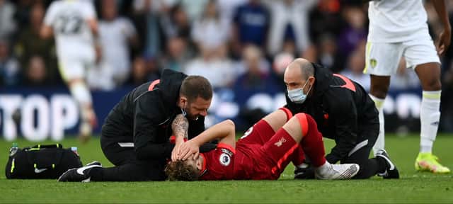 Harvey Elliott of Liverpool receives medical treatment during the Premier League match against Leeds United. Photo: Shaun Botterill/Getty Images