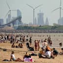 People enjoy the warm weather on Crosby Beach last year. (Photo: Christopher Furlong/Getty Images)