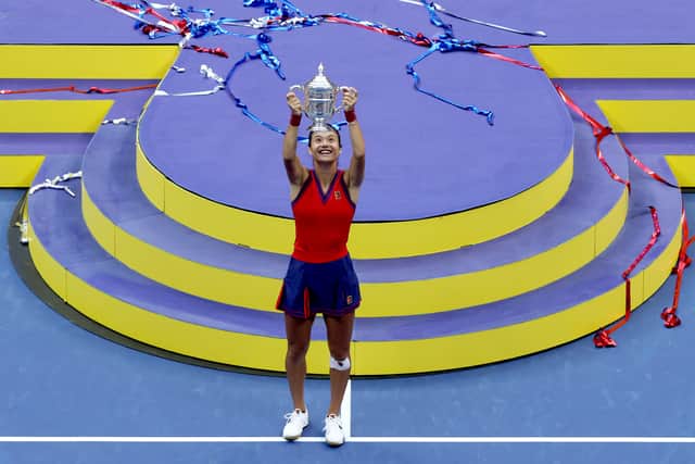 NEW YORK, NEW YORK - SEPTEMBER 11: Emma Raducanu of Great Britain celebrates with the championship trophy after defeating Leylah Annie Fernandez of Canada during their Women’s Singles final match on Day Thirteen of the 2021 US Open at the USTA Billie Jean King National Tennis Center on September 11, 2021 in the Flushing neighborhood of the Queens borough of New York City. (Photo by Matthew Stockman/Getty Images)