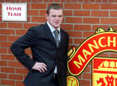 Wayne Rooney poses after signing for Manchester United from Everton in 2004. Picture: PAUL BARKER/AFP via Getty Images