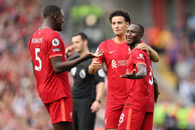 LIVERPOOL, ENGLAND - SEPTEMBER 18: Naby Keita of Liverpool celebrates with teammates Curtis Jones and Ibrahima Konate after scoring their team’s third goal  during the Premier League match between Liverpool and Crystal Palace at Anfield on September 18, 2021 in Liverpool, England. (Photo by Clive Brunskill/Getty Images)