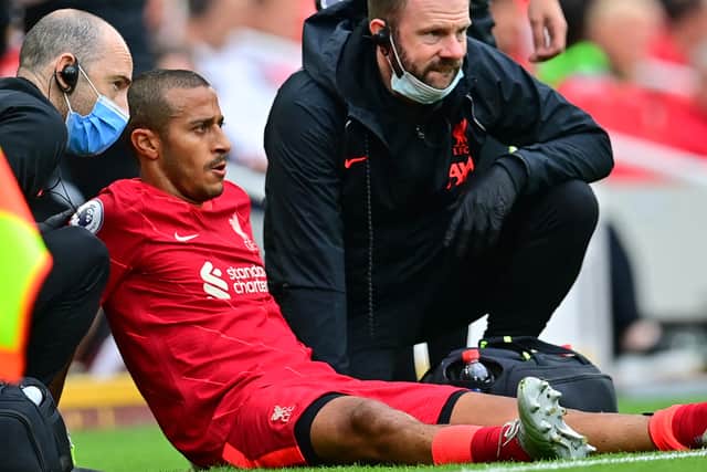Thiago Alcantara receives treatment after suffering an injury in Liverpool’s defeat of Crystal Palace. Picture: PAUL ELLIS/AFP via Getty Image
