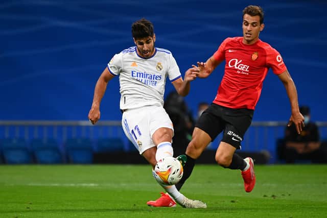 Marco Asensio scores for Real Madrid against Mallorca. Picture: GABRIEL BOUYS/AFP via Getty Images)