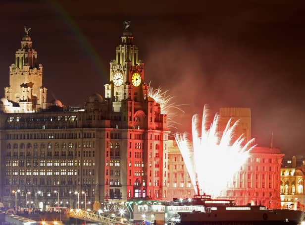 <p>Fireworks go off near the Liver Building. Photo: Christopher Furlong/Getty Images</p>