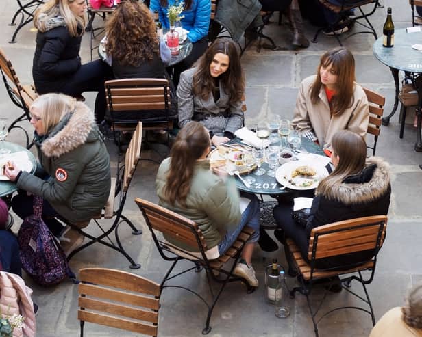 People eating outside. Image: Shutterstock