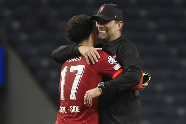 Curtis Jones embraces Liverpool boss Jurgen Klopp after the defeat of Porto. Picture: MIGUEL RIOPA/AFP via Getty Images