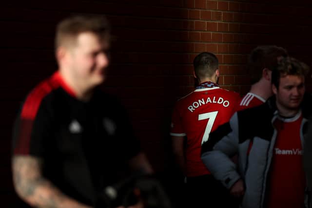 A Manchester United fan wears a Cristiano Ronaldo shirt outside Old Trafford. Picture: Alex Pantling/Getty Images