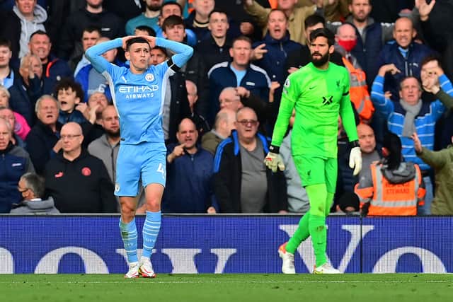 Man City’s Phil Foden had a big chance saved by Liverpool keeper Alisson. Picture: PAUL ELLIS/AFP via Getty Images