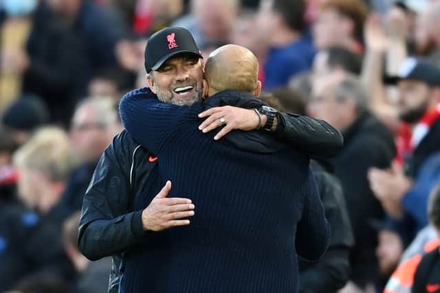 Liverpool boss Jurgen Klopp and Man City manager Pep Guardiola embrace after the game. Picture: Michael Regan/Getty Images
