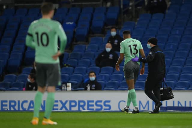 Yerry Mina limps off injured against Brighton last season. Picture: MIKE HEWITT/POOL/AFP via Getty Images