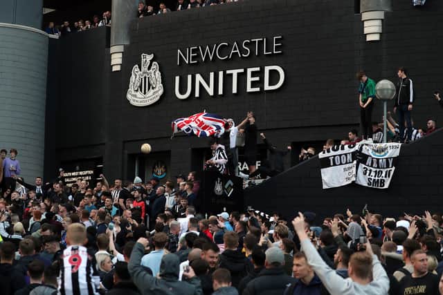 Newcastle fans celebrate the club’s takeover outside St James’ Park. Picture: AFP via Getty Images