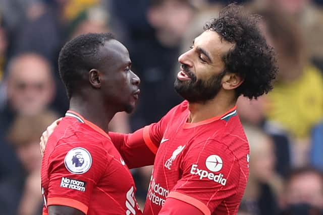 Sadio Mane celebrates the scoring for Liverpool against Watford with Mo Salh. Picture: Richard Heathcote/Getty Images
