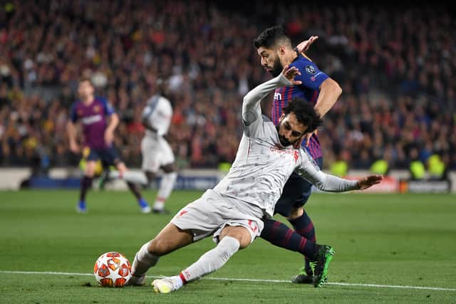 Mo Salah battles Luis Suarez during Liverpool’s Champions League semi-final first leg against Barcelona in May 2019. Picture: Michael Regan/Getty Images 