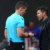 Diego Simeone speaks to the referee during Liverpool’s defeat of Atletico Madrid. Picture: Angel Martinez/Getty Images