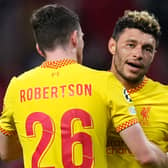 Alex Oxlade-Chamberlain celebrates Liverpool’s defeat of Atletico Madrid with Andy Robertson. Picture: Angel Martinez/Getty Images