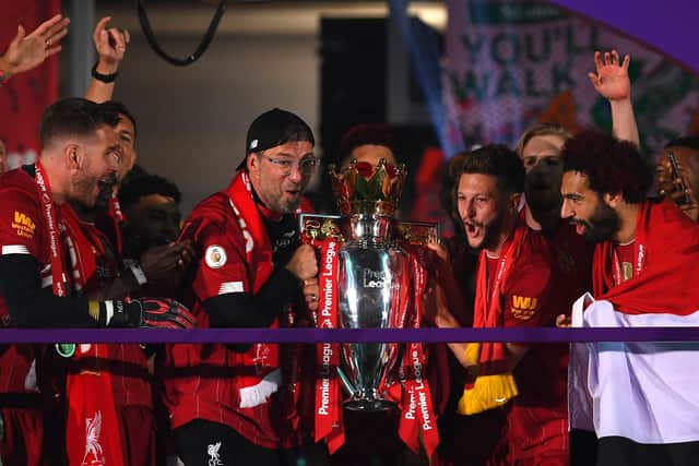 Jurgen Klopp and Adam Lallana lift the Premier League trophy. Picture: Laurence Griffiths/Getty Images