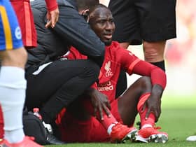 Naby Keita receives treatment before having to come off injured in Liverpool’s clash against Brighton. Picture:PAUL ELLIS/AFP via Getty Images