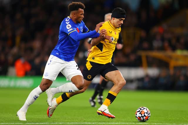 Raul Jimenez of Wolverhampton Wanderers is challenged by Jean-Philippe Gbamin of Everton during the Premier League match between Wolverhampton Wanderers and Everton at Molineux on November 01, 2021 in Wolverhampton, England. (Photo by Catherine Ivill/Getty Images)