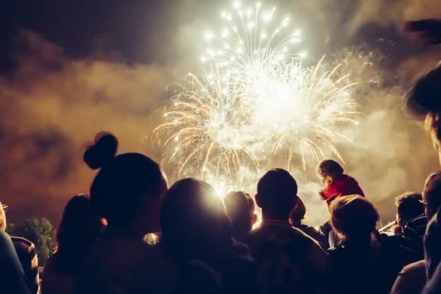 A crowd watching fireworks. Photo: Shutterstock
