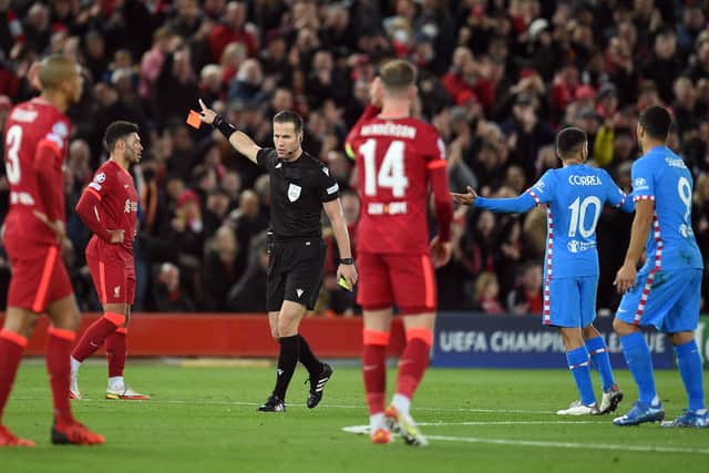 Referee Danny Makkelie sends off Filipe in Liverpool’s defeat of Atletico Madrid in the Champions League. Picture: OLI SCARFF/AFP via Getty Images