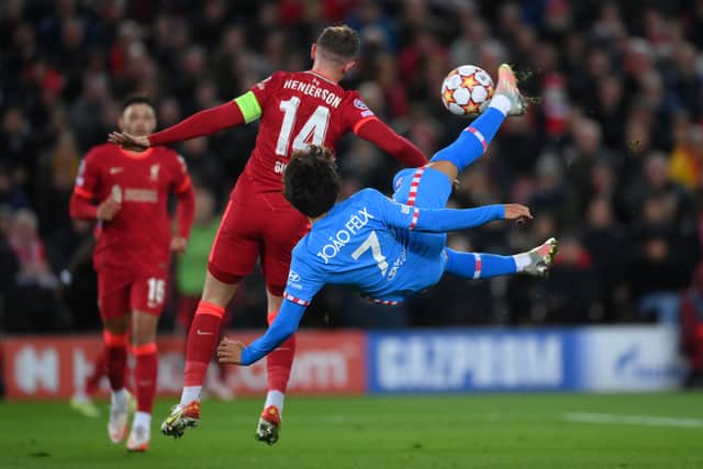 Joao Felix of Atletico Madrid attempts an overhead kick past Jordan Henderson of Liverpool. Picture: Laurence Griffiths/Getty Images