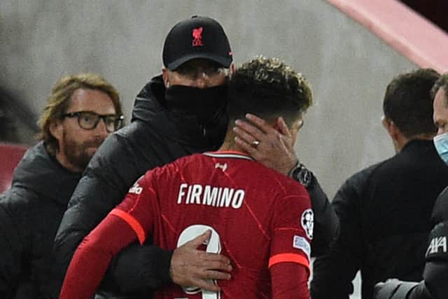 Roberto Firmino limped off in Liverpool’s win over Atletico Madrid. Picture: OLI SCARFF/AFP via Getty Images