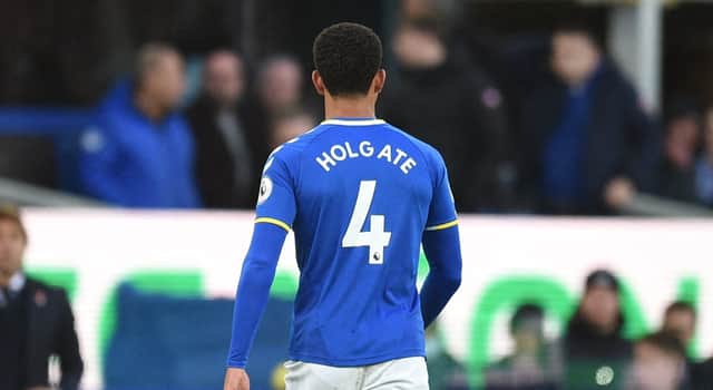 Mason Holgate walks off the pitch after being sent off during Everton’s draw with Tottenham. Picture: OLI SCARFF/AFP via Getty Images