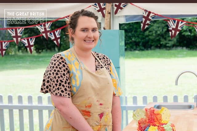 Lizzie poses with her final bake on GBBO. Image: @BritishBakeOff/twitter