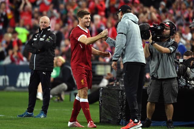 Liverpool player Steven Gerrard (2nd L) shakes hands with coach Jurgen Klopp after being substituted during their end-of-season friendly football match against Sydney FC at the Olympic Stadium in Sydney on May 24, 2017. / AFP PHOTO / WILLIAM WEST        (Photo credit should read WILLIAM WEST/AFP via Getty Images)